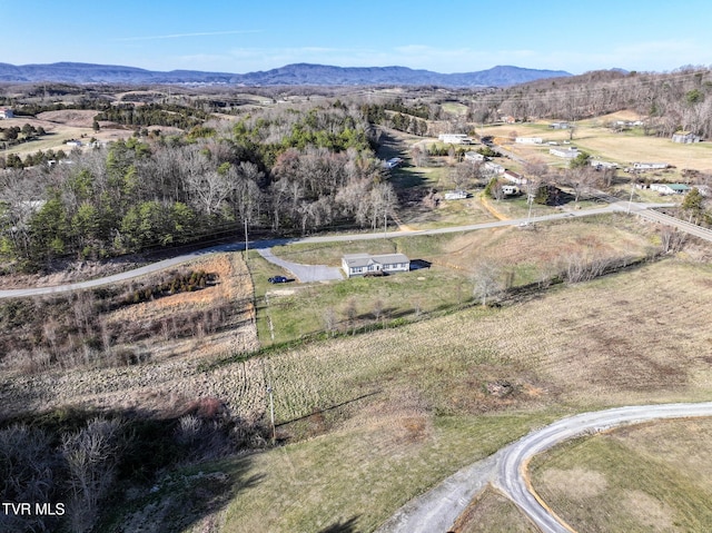 drone / aerial view featuring a rural view and a mountain view