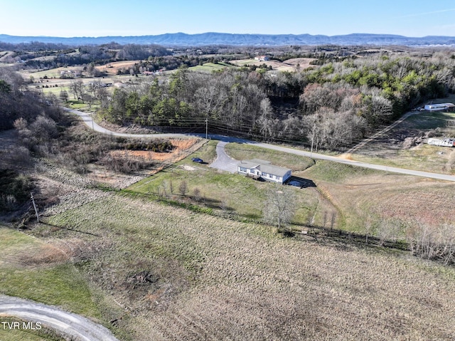 drone / aerial view featuring a rural view and a mountain view