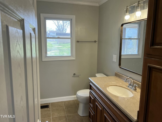 bathroom featuring vanity, visible vents, baseboards, tile patterned flooring, and toilet