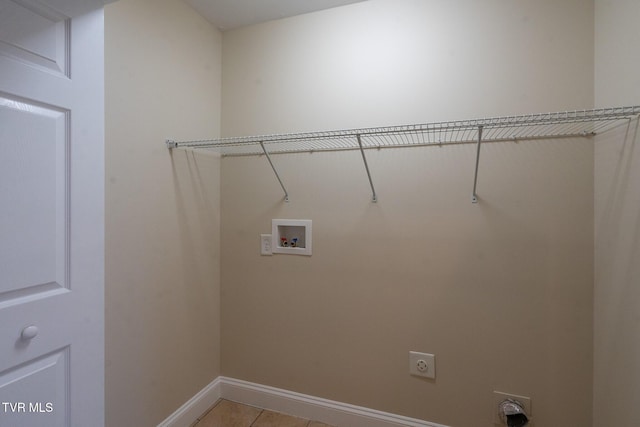 laundry room with light tile patterned floors, baseboards, hookup for an electric dryer, laundry area, and washer hookup