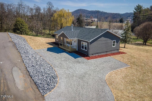 birds eye view of property featuring a mountain view