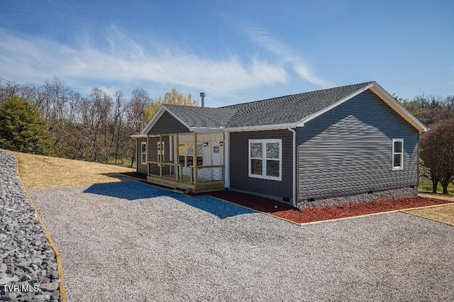 view of front of home with a porch and crawl space