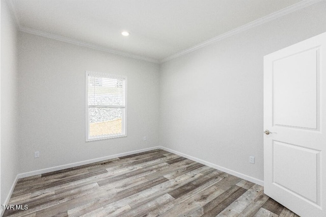 unfurnished room with recessed lighting, crown molding, baseboards, and wood finished floors