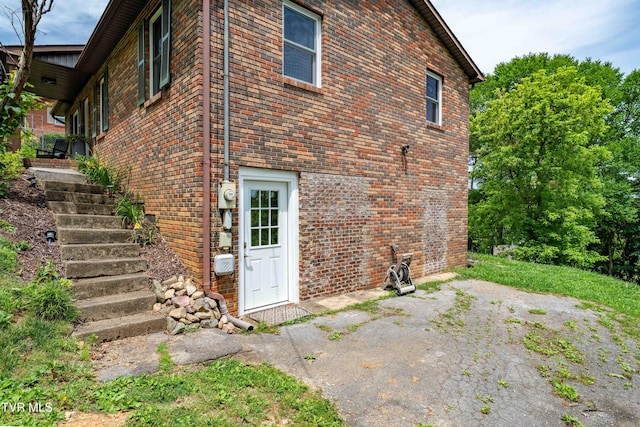 1212 Rocky Hollow Rd, Jonesborough, TN 37659 - view of side of home with brick siding and a patio area