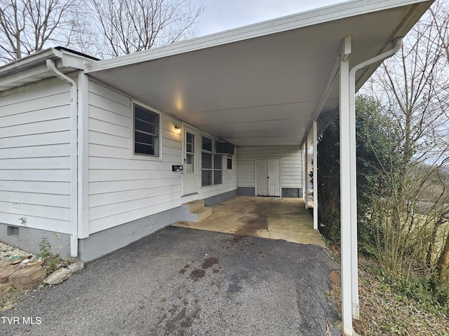 view of car parking with a carport and driveway