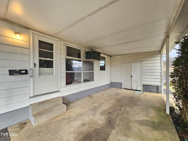 entrance to property with a carport