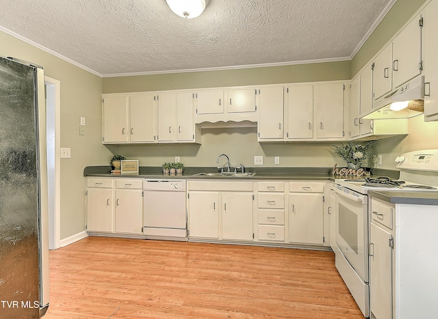kitchen with a sink, white appliances, under cabinet range hood, and light wood-style flooring