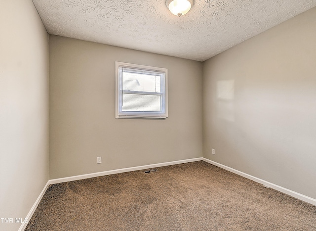 unfurnished room with baseboards and carpet floors