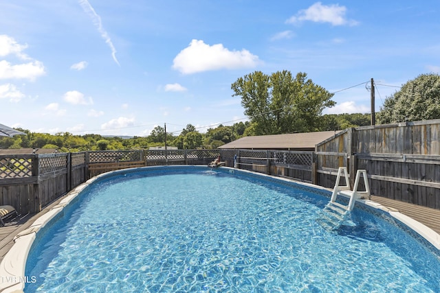 view of swimming pool featuring a fenced in pool and a fenced backyard