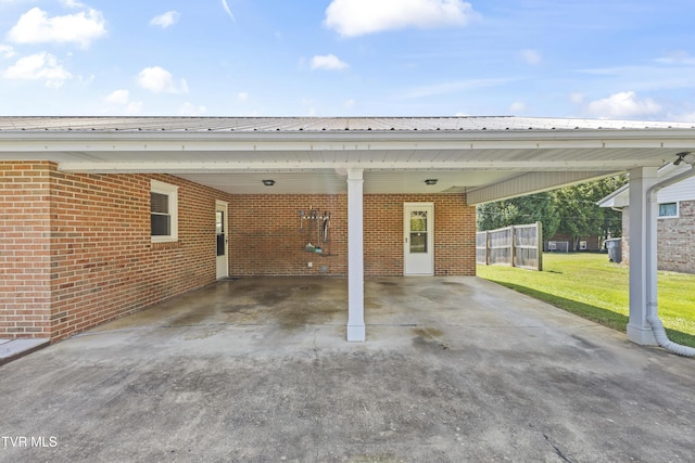 view of parking / parking lot with an attached carport and driveway