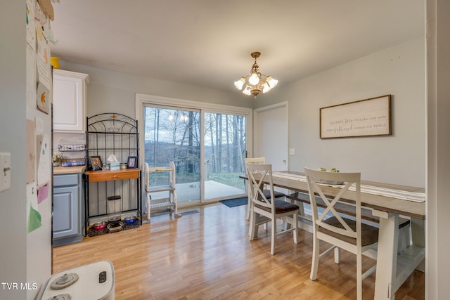4511 Grace Dr, Kingsport, TN 37664 - dining room featuring light wood finished floors and an inviting chandelier