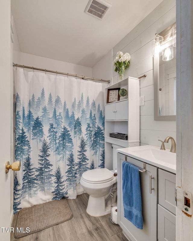 4511 Grace Dr, Kingsport, TN 37664 - full bathroom with visible vents, toilet, a shower with shower curtain, wood finished floors, and vanity