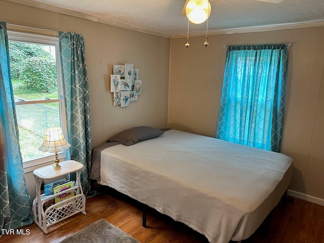 109 Chestnut St, Greeneville, TN 37745 - bedroom with a textured ceiling, wood finished floors, and crown molding