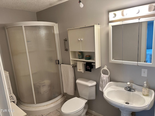 109 Chestnut St, Greeneville, TN 37745 - bathroom featuring a textured ceiling, toilet, a stall shower, and a sink