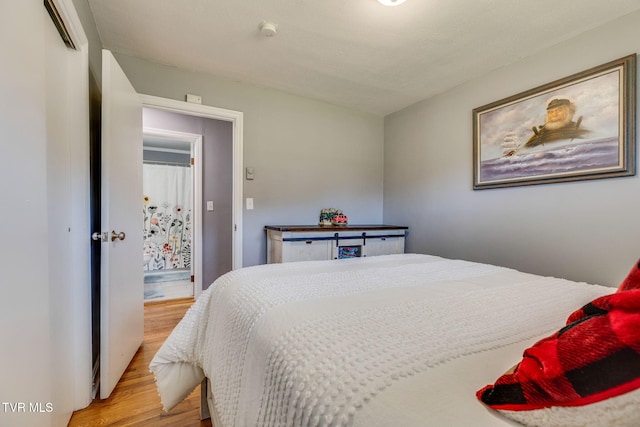 bedroom with light wood-style flooring