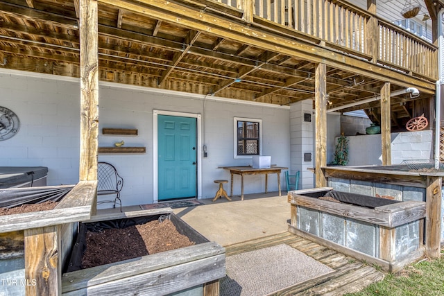 doorway to property with concrete block siding