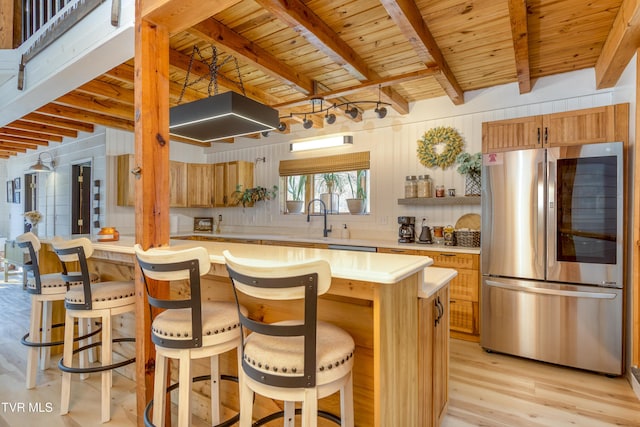 kitchen with light wood-type flooring, light countertops, beam ceiling, wooden ceiling, and smart refrigerator