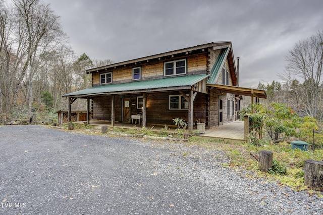 368 Ripshin Lake Rd, Roan Mountain, TN 37687 - view of front of house with metal roof and a porch