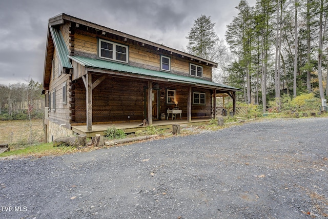368 Ripshin Lake Rd, Roan Mountain, TN 37687 - cabin with a porch, metal roof, and log exterior