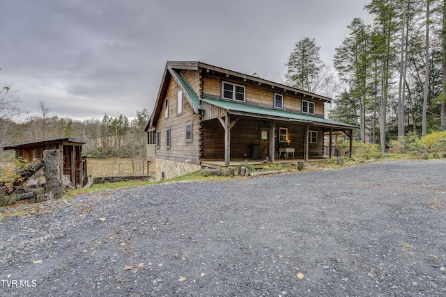 368 Ripshin Lake Rd, Roan Mountain, TN 37687 - log cabin with covered porch, metal roof, and log siding