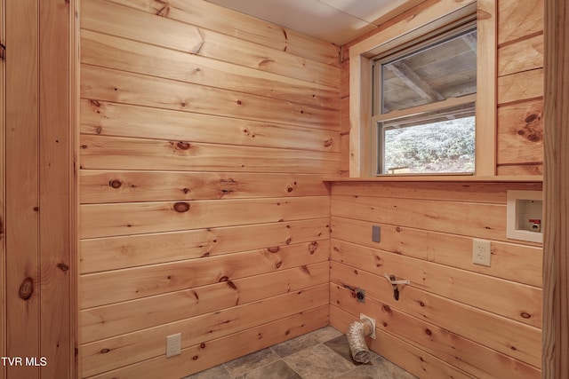 368 Ripshin Lake Rd, Roan Mountain, TN 37687 - laundry room with wood walls, stone finish flooring, and hookup for a washing machine