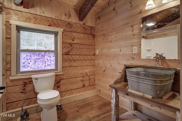 368 Ripshin Lake Rd, Roan Mountain, TN 37687 - bathroom featuring toilet, wood finished floors, wood walls, wooden ceiling, and beam ceiling