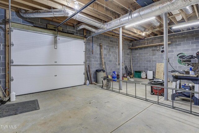 368 Ripshin Lake Rd, Roan Mountain, TN 37687 - garage featuring concrete block wall