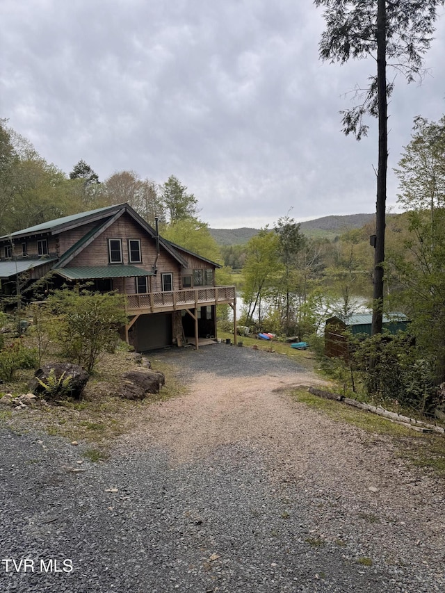368 Ripshin Lake Rd, Roan Mountain, TN 37687 - view of side of home featuring driveway and a deck