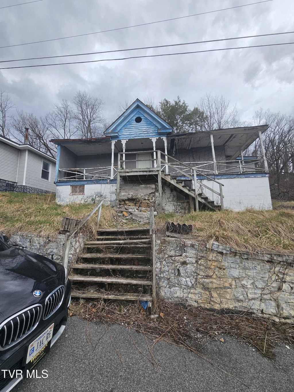 view of front of property featuring stairs