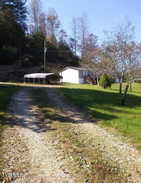 9823 Hollyfield Rd, Pound, VA 24279 - view of yard featuring dirt driveway and a carport