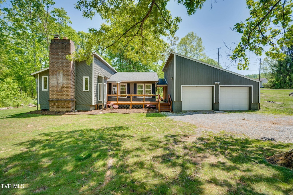 mid-century inspired home with a front lawn, a wooden deck, and a chimney