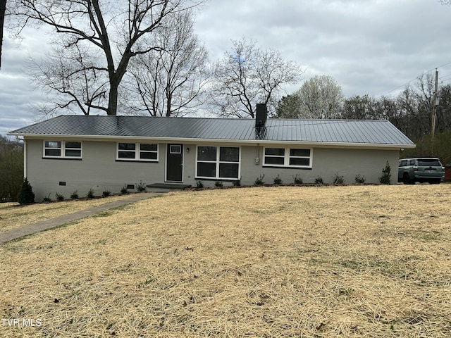 single story home with crawl space, a chimney, and metal roof