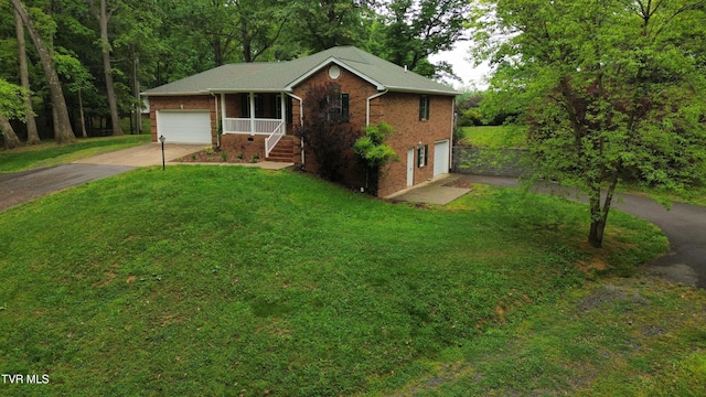 15399 Leatherwood Rd, Abingdon, VA 24210 - ranch-style house featuring brick siding, concrete driveway, a front yard, and an attached garage