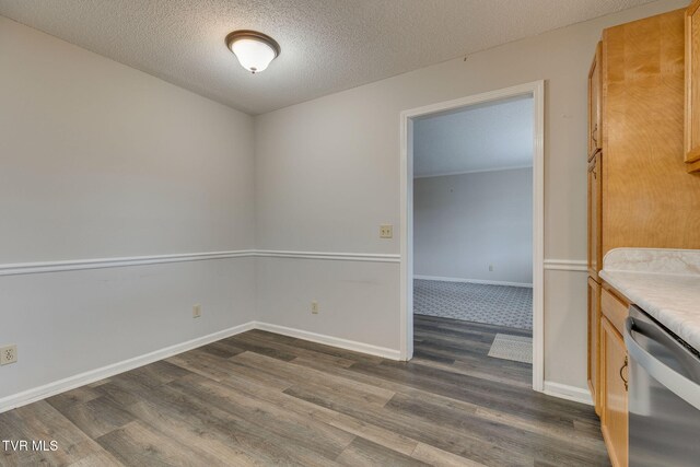 interior space with baseboards, dark wood-style flooring, and a textured ceiling