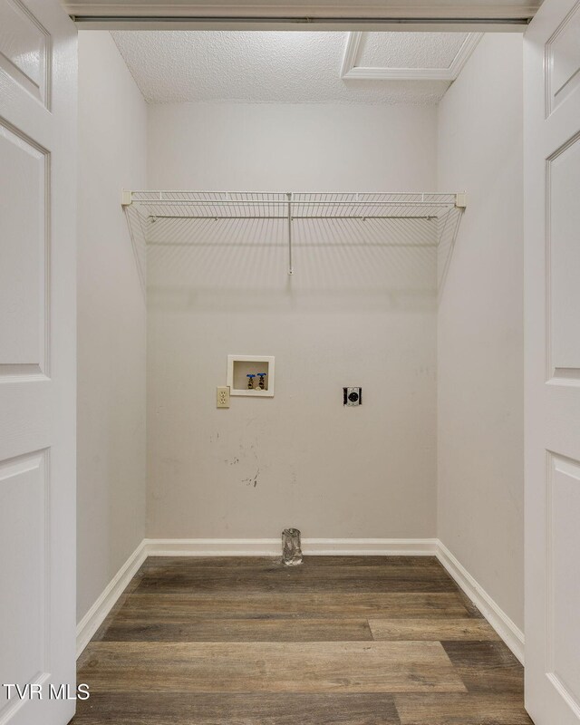 washroom featuring hookup for a washing machine, baseboards, hookup for an electric dryer, laundry area, and dark wood-style flooring