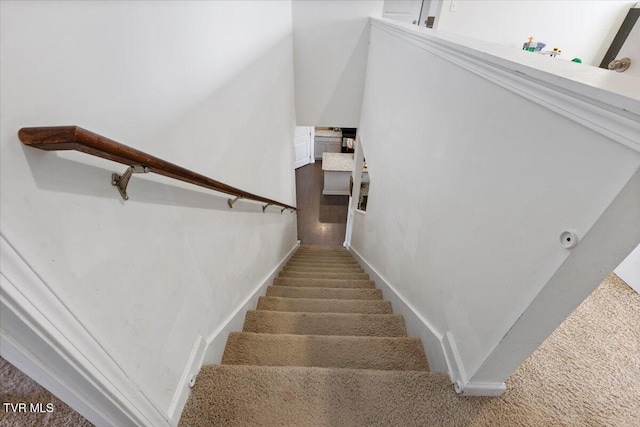stairs featuring baseboards