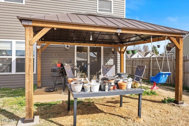 view of patio featuring a gazebo and fence