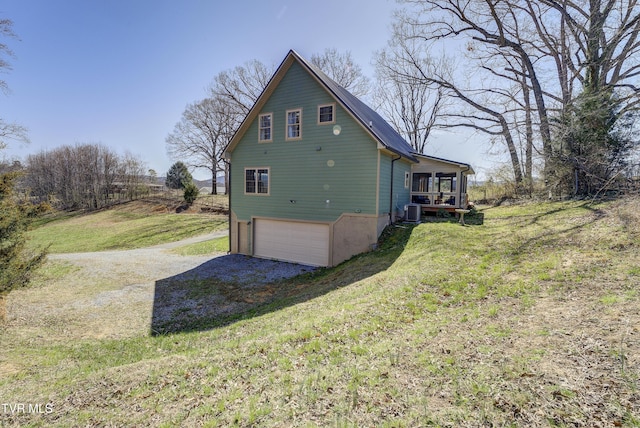 137 Unaka View Rd, Johnson City, TN 37601 - view of side of property with central air condition unit, a lawn, driveway, and a garage