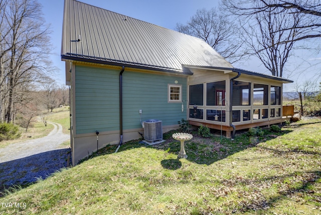 137 Unaka View Rd, Johnson City, TN 37601 - rear view of house with central AC, a lawn, metal roof, a sunroom, and driveway