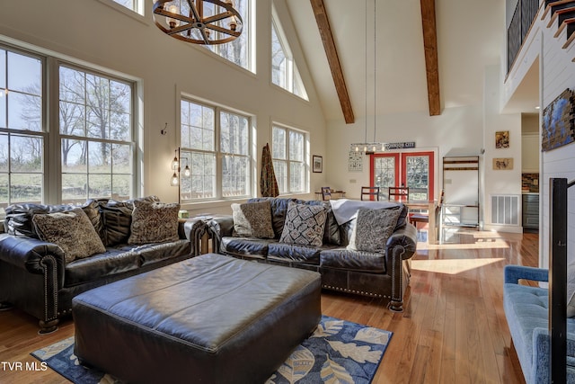 137 Unaka View Rd, Johnson City, TN 37601 - living room with hardwood / wood-style floors, visible vents, high vaulted ceiling, beam ceiling, and a wealth of natural light