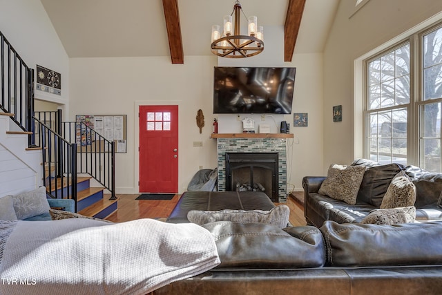 137 Unaka View Rd, Johnson City, TN 37601 - living room with an inviting chandelier, stairway, wood finished floors, and a wealth of natural light
