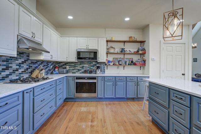 137 Unaka View Rd, Johnson City, TN 37601 - kitchen featuring under cabinet range hood, appliances with stainless steel finishes, white cabinetry, and light wood-style floors