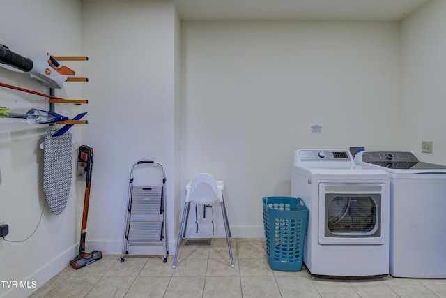 137 Unaka View Rd, Johnson City, TN 37601 - laundry room featuring laundry area, light tile patterned floors, separate washer and dryer, and baseboards