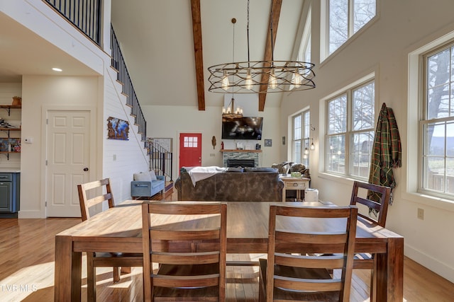 137 Unaka View Rd, Johnson City, TN 37601 - dining space featuring a wealth of natural light, light wood-style flooring, stairs, and a high ceiling