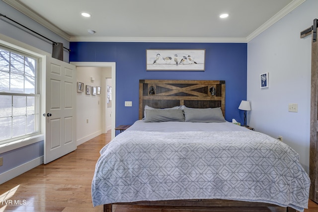 137 Unaka View Rd, Johnson City, TN 37601 - bedroom with ornamental molding, recessed lighting, a barn door, light wood-style floors, and baseboards