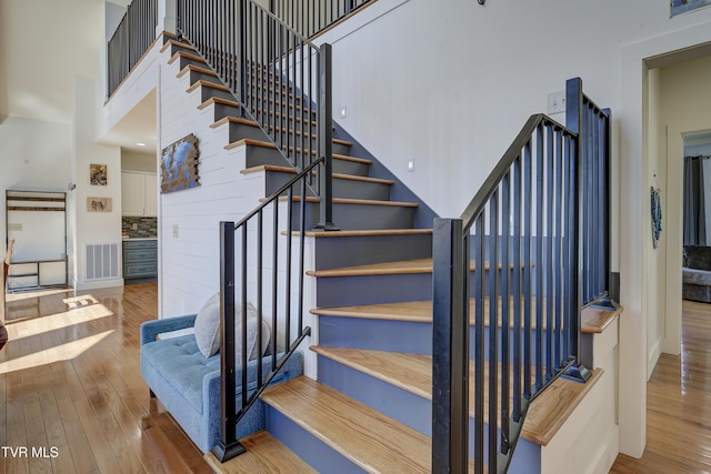 137 Unaka View Rd, Johnson City, TN 37601 - staircase featuring hardwood / wood-style flooring, visible vents, and a towering ceiling