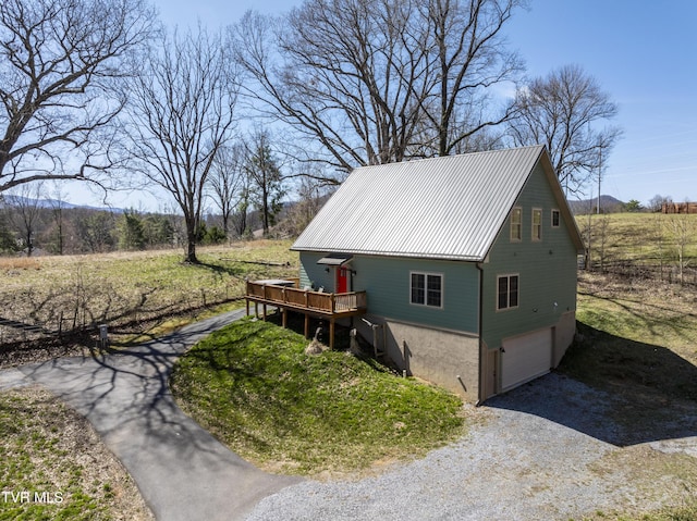 137 Unaka View Rd, Johnson City, TN 37601 - exterior space with an attached garage, metal roof, gravel driveway, and a deck