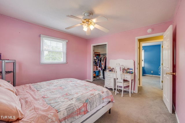 carpeted bedroom with baseboards, a closet, and ceiling fan