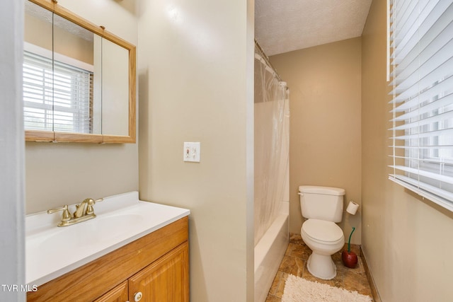 bathroom with shower / tub combo, vanity, tile patterned flooring, and toilet