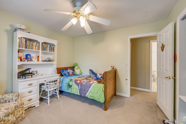 bedroom featuring light colored carpet and ceiling fan